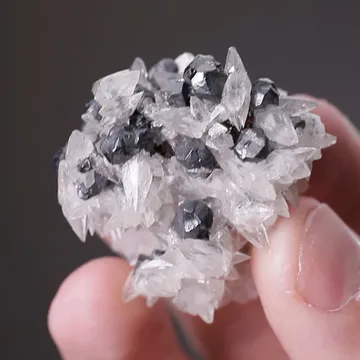 Acanthite after Argentite with Calcite