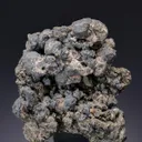 Acanthite ps. after Argentite on Pyrite - image 1