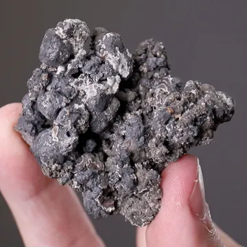 Acanthite ps. after Argentite on Pyrite