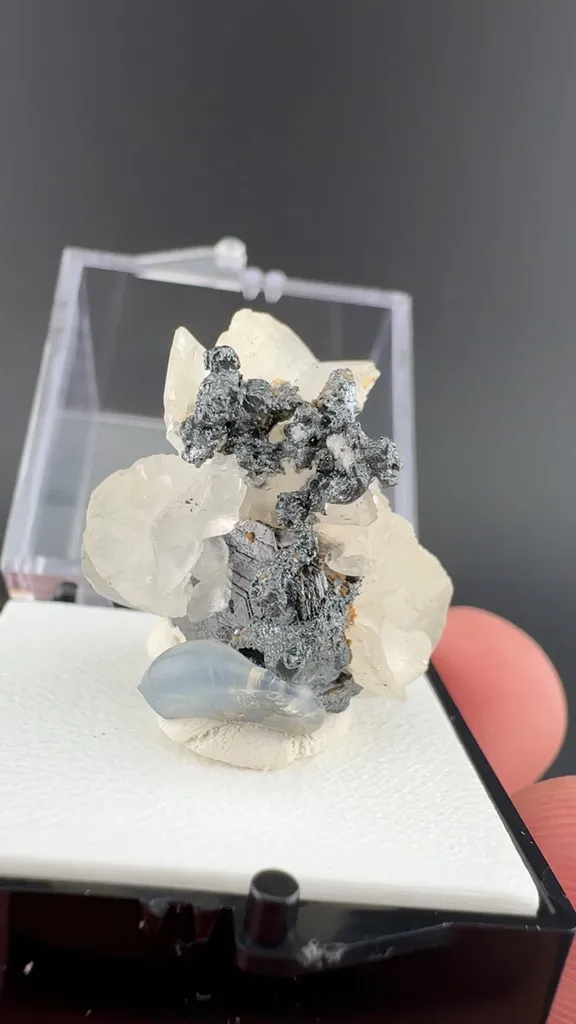 Acanthite with Polybasite, Calcite image