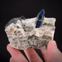 Afghanite (TL) (fl) on Calcite (fl) - image 1