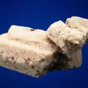 Allanite-(Ce) on Microcline (Carlsbad twin) - image 3
