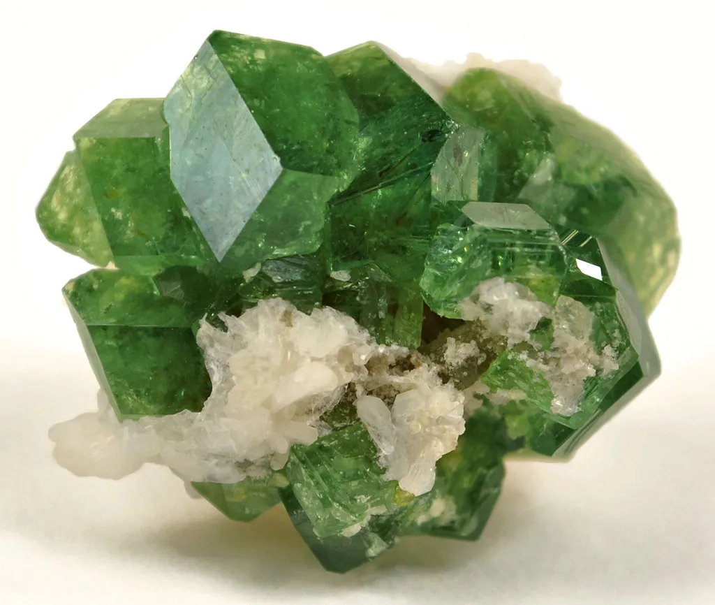 Andradite Var. Demantoid Garnet With Stilbite image