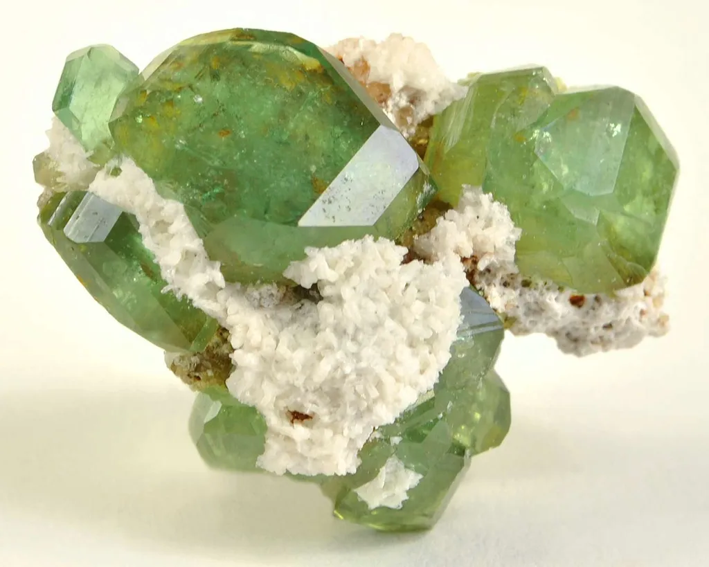 Andradite Var. Demantoid Garnet With Stilbite image