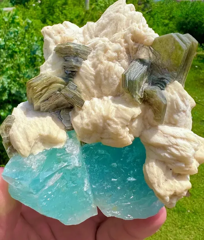 Aquamarine crystals with Muscovite and Feldspar image