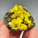 Autunite on Quartz on Granite - image 1