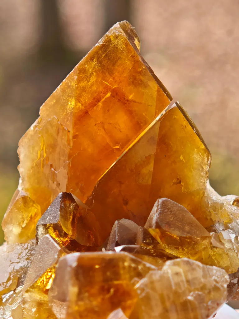 Barite from Pöhla, Germany. Beautiful cluster of lustrous and translucent of top amber colored barite crystal with phantoms image