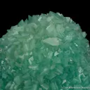 Baryte included by Malachite on Malachite stalactite - image 2