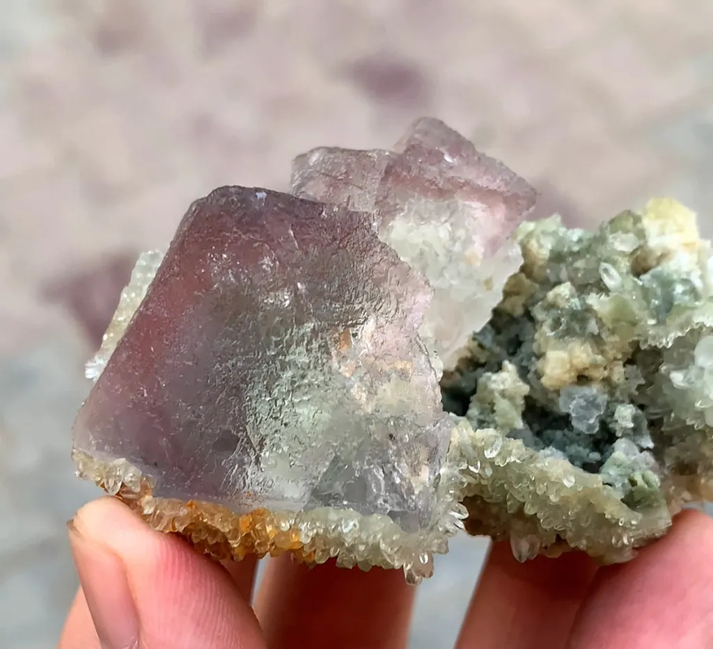 Beautiful prismatic bi-color zoning Fluorite specimen with sparkling tiny quartz clusters image