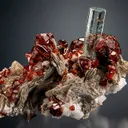 Beryl var. Aquamarine with Spessartine on Muscovite - image 1