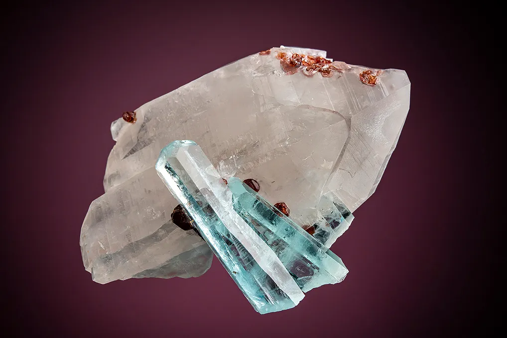 Beryl var. Aquamarine with Spessartine on Quartz image