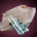 Beryl var. Aquamarine with Spessartine on Quartz - image 1