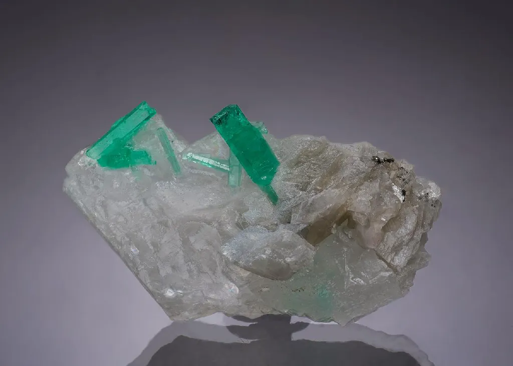 Beryl var. Emerald on Calcite image