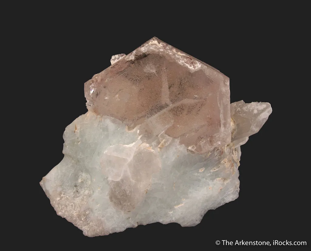 Beryl var. Morganite, on blue Albite (mine owner's collection) image