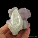 Calcite (fluor.) on Quartz var. Amethyst - image 2