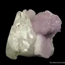 Calcite (fluor.) on Quartz var. Amethyst - image 1