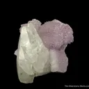 Calcite (fluor.) on Quartz var. Amethyst - image 5