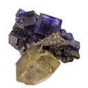 Calcite (twin) on Fluorite - image 6