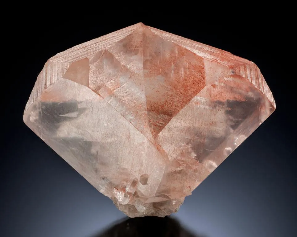 Calcite twin with Hematite inclusions - image 1