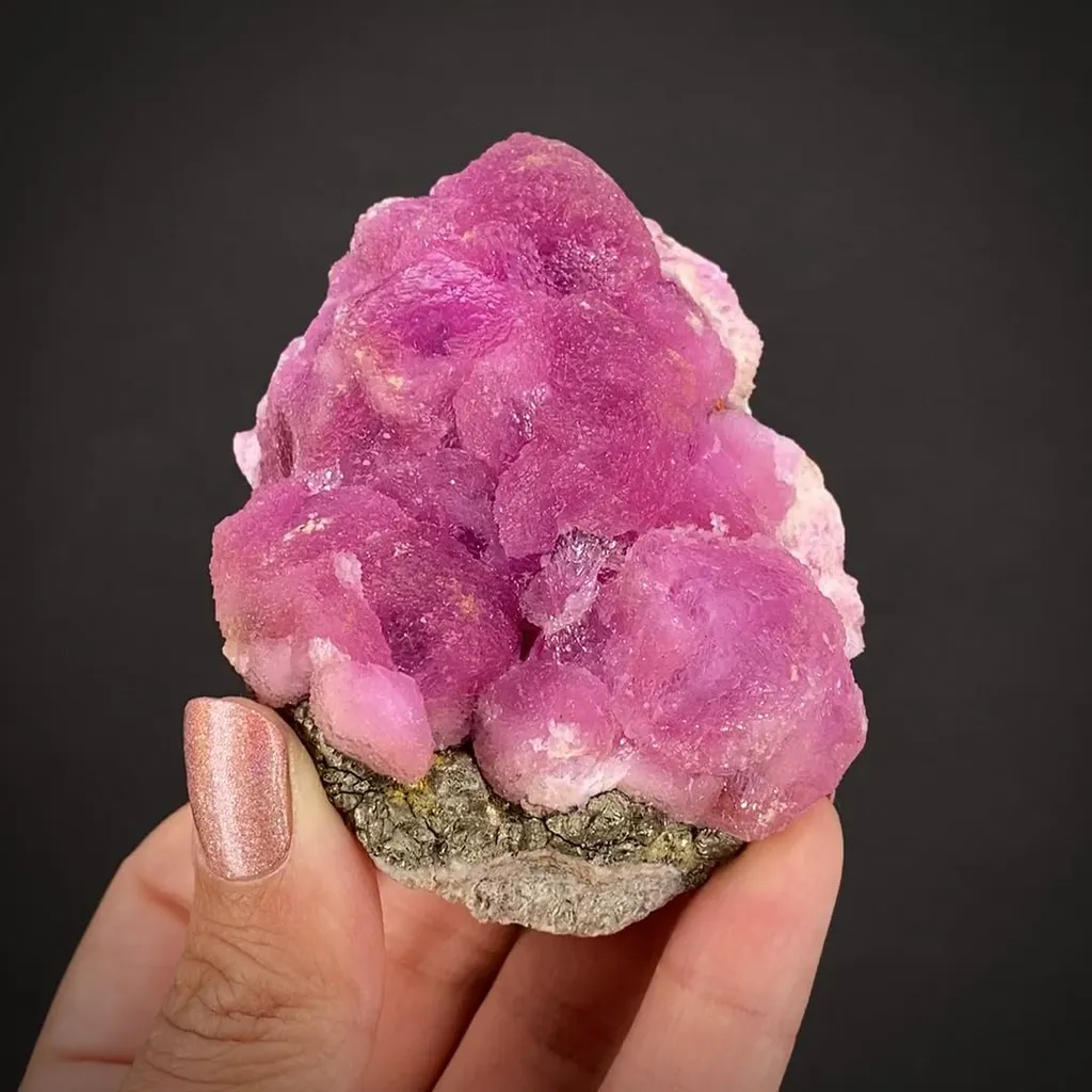 Calcite (Var: Cobalt-bearing Calcite) (fl) on Pyrite image