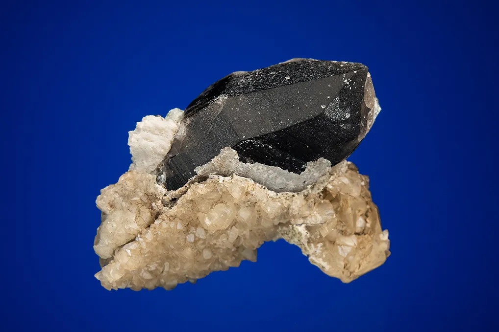 Calcite with Beryl var. Aquamarine on Quartz var. Smoky image