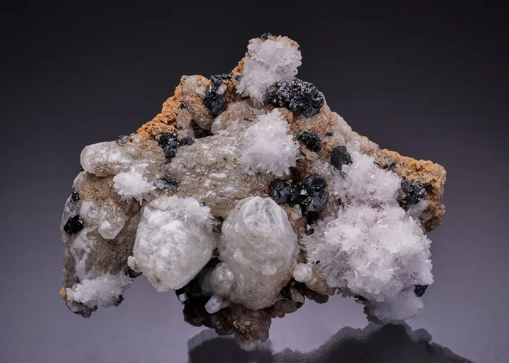 Calcite with Braunite and OYELITE image