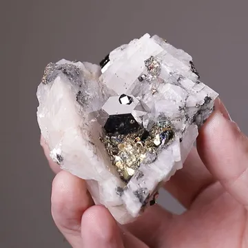Carrollite with Pyrite on Calcite