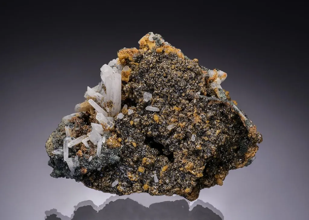 CASSITERITE with SIDERITE on QUARTZ
