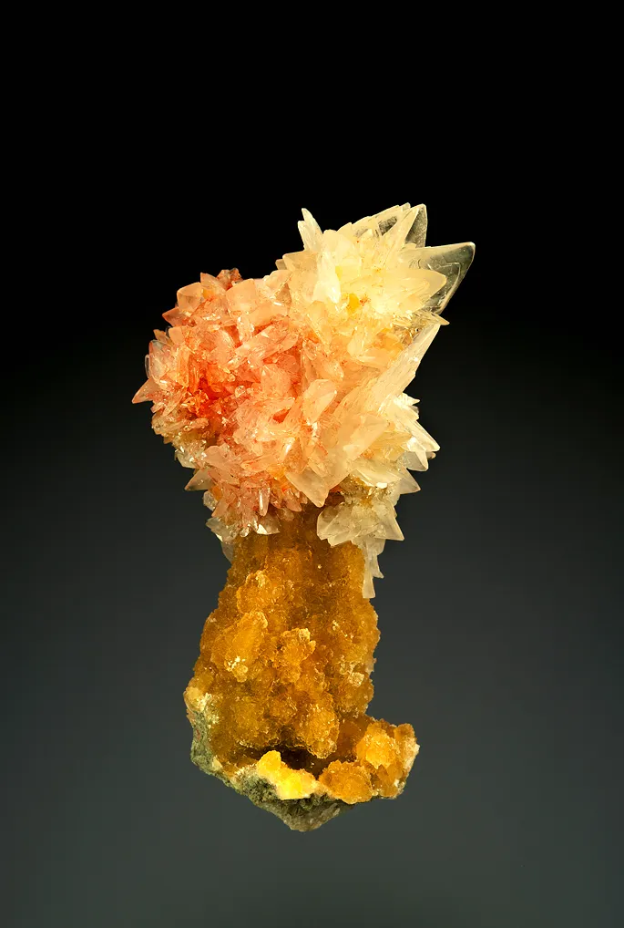 Colemanite with Realgar on Calcite image