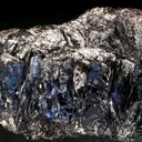 Covellite grouping with white unknown mineral dusting - image 2