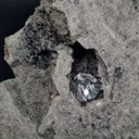 Diamond quartz in a black geode from Ribiers in France. Quartz are well crystallized and shiny, the glossy black matrix makes the crystals - image 2