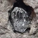 Diamond quartz in a black geode from Ribiers in France. Quartz are well crystallized and shiny, the glossy black matrix makes the crystals - image 1