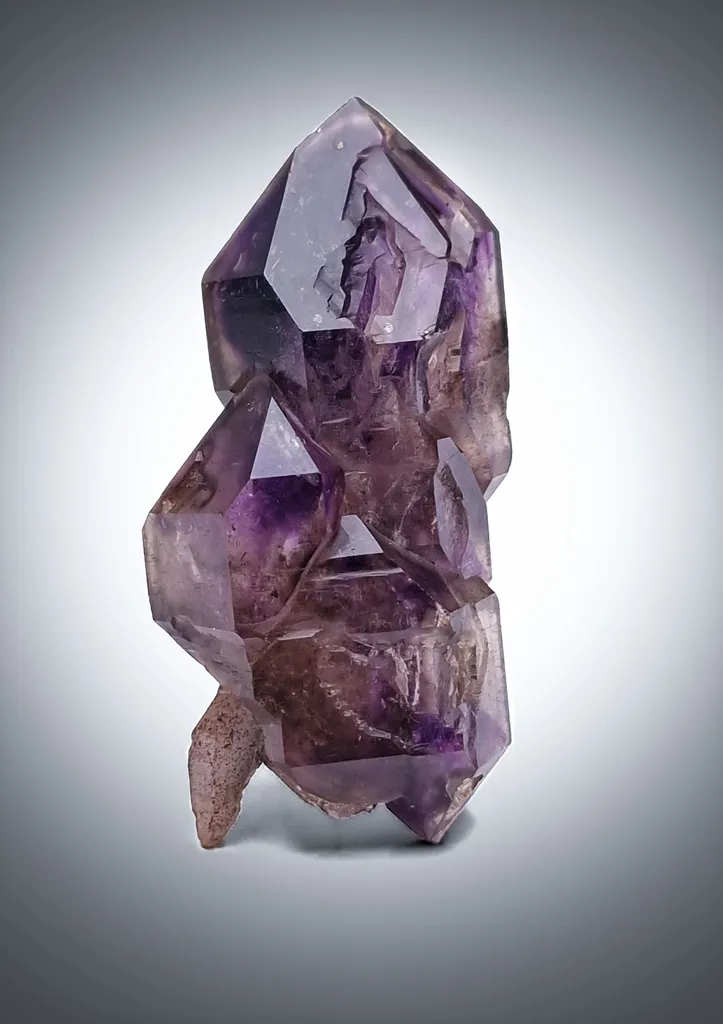 Elegant scepter-shaped amethyst with hematite inclusions image