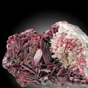 Erythrite from Morocco. Rich group of lanceolated tabular crystals of erythrite with very intense color on matrix with quartz crystals. - image 5