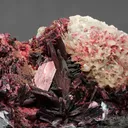 Erythrite from Morocco. Rich group of lanceolated tabular crystals of erythrite with very intense color on matrix with quartz crystals. - image 4