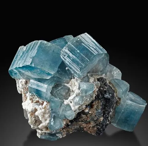 Fluorapatite, gemmy, pale blue crystals on Calcite image