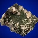 Fluorapatite with Quartz var. Smoky on Microcline - image 1