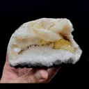 Fluorescent Powellite with Stilbite Inside Heuladnite Geode - image 2