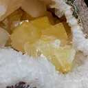 Fluorescent Powellite with Stilbite Inside Heuladnite Geode - image 4