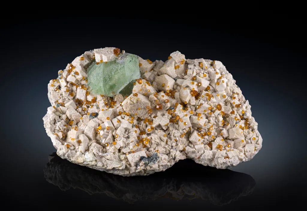 Fluorite and Spessartine from China, Tongbei, Wushan Spessartine Mine image