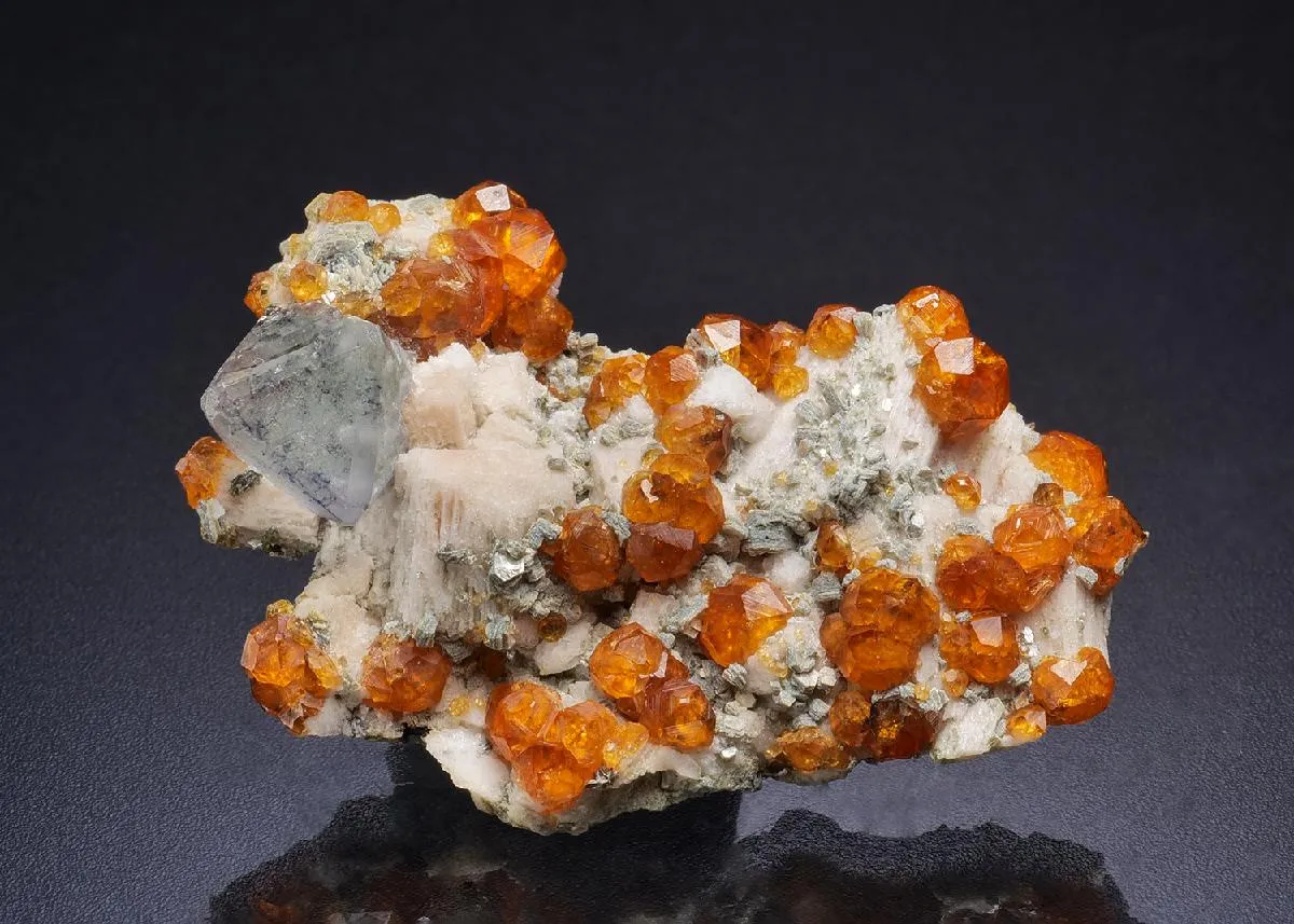 Fluorite with Spessartine on Microcline - image 1