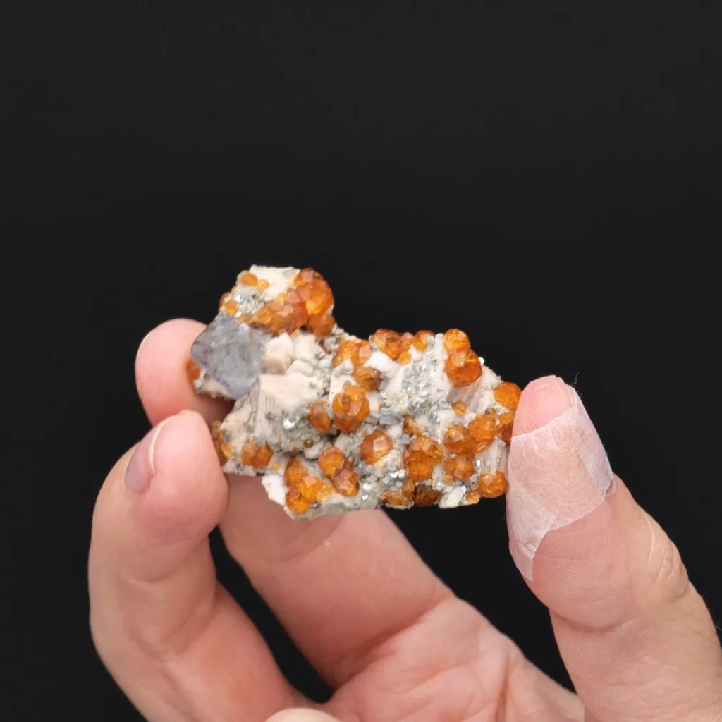Fluorite with Spessartine on Microcline - image 2
