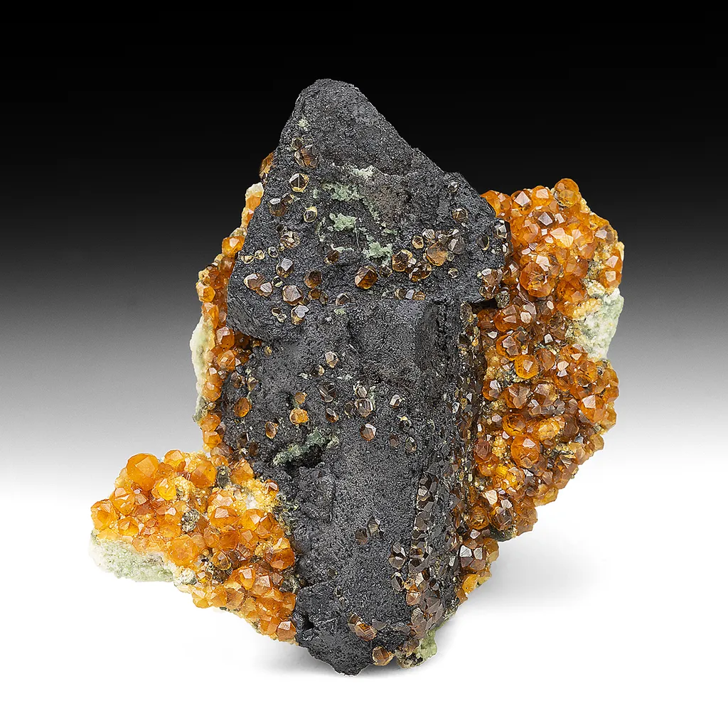 Goethite after Helvite with Spessartine image