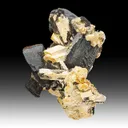 Goethite after Siderite with Hematite, Schorl, Microcline - image 1
