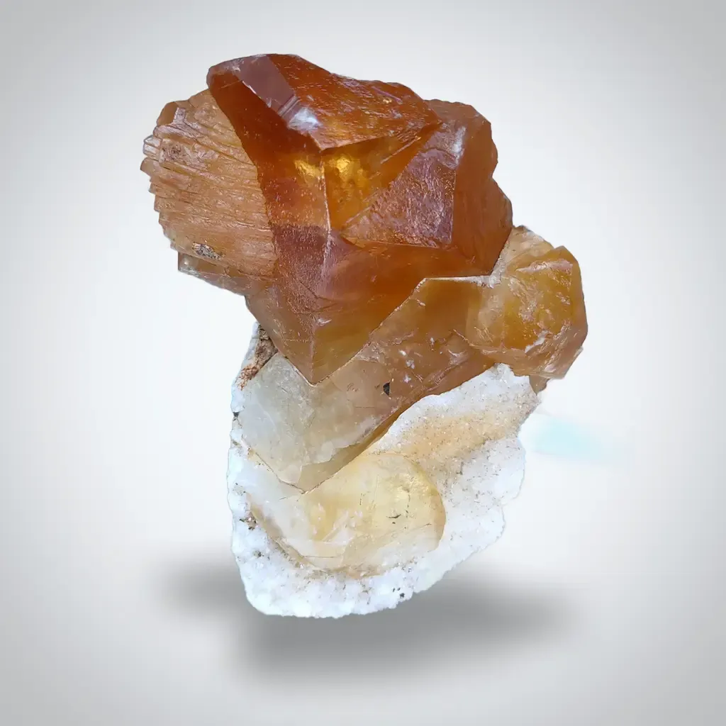 Golden Calcite on Quartz. Available for sale image