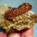 Grossular (Var: Hessonite), Quartz, Axinite-(Fe) - image 1