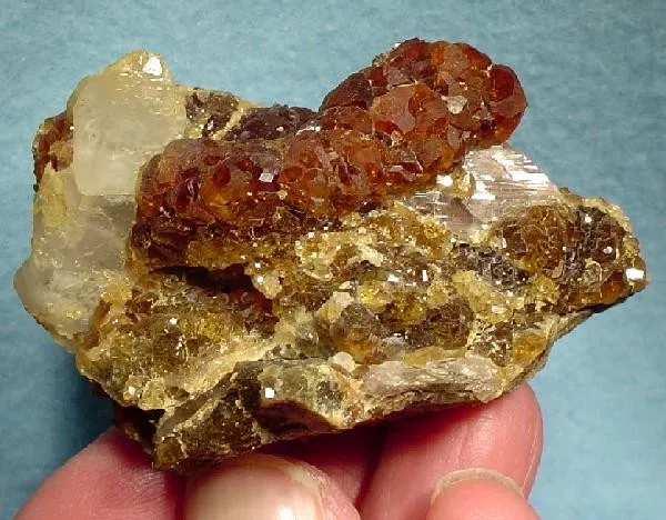 Grossular (Var: Hessonite), Quartz, Axinite-(Fe) - image 1