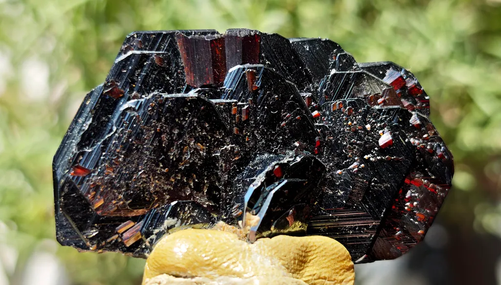 High luster Hematite with large red Rutile from Cavradi Gorge, Sedrun, Switzerland image