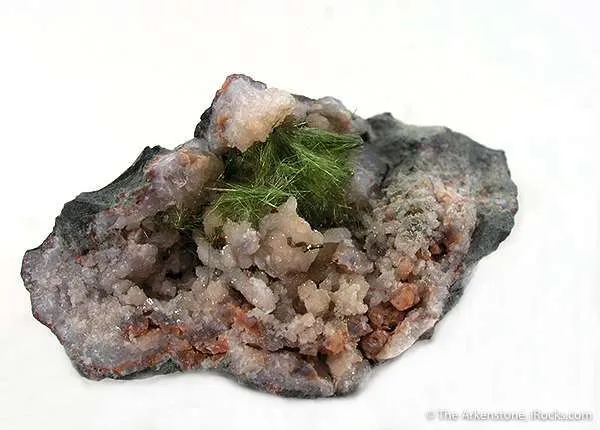 Honessite With Pyrite in Quartz Geode image