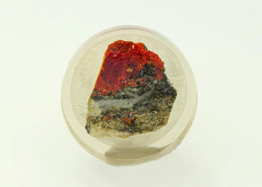 JANKOVIĆITE with PARAPIERROTITE and Realgar (Polished Section) image